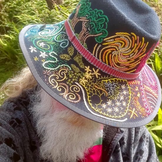 Owen Kelly wearing a hat he embroidered