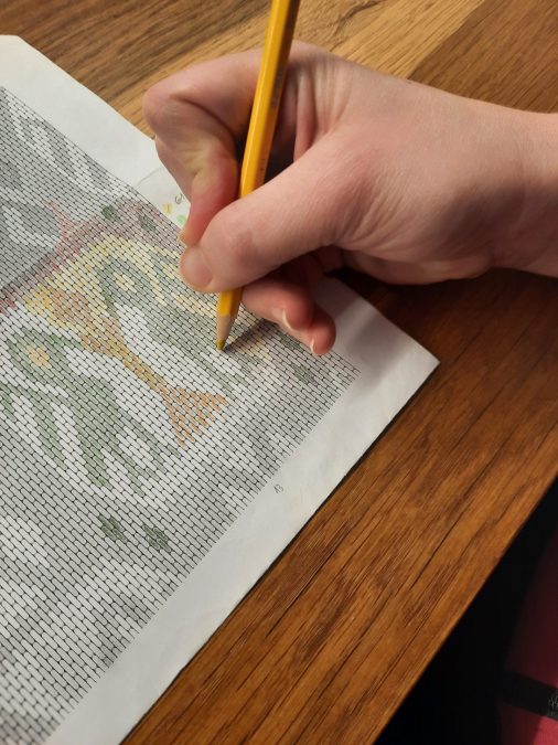 Coloring the printed design guide as a reference