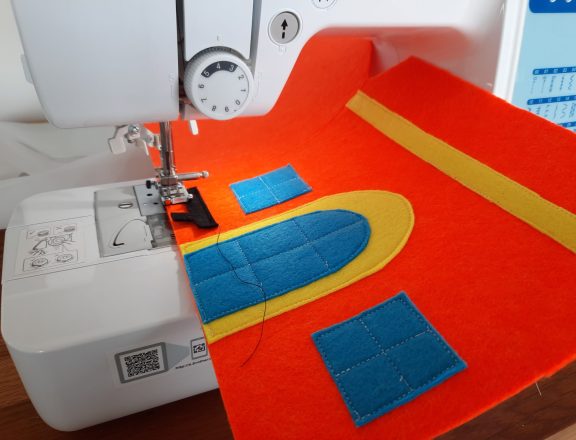 Making our felt bus book: the train station entrance