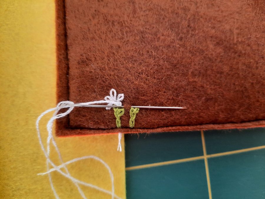 Making our felt bus book: adding flowers to the tunnel