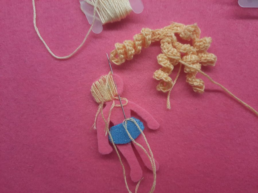 Making our felt bus book: the doll and her clothes