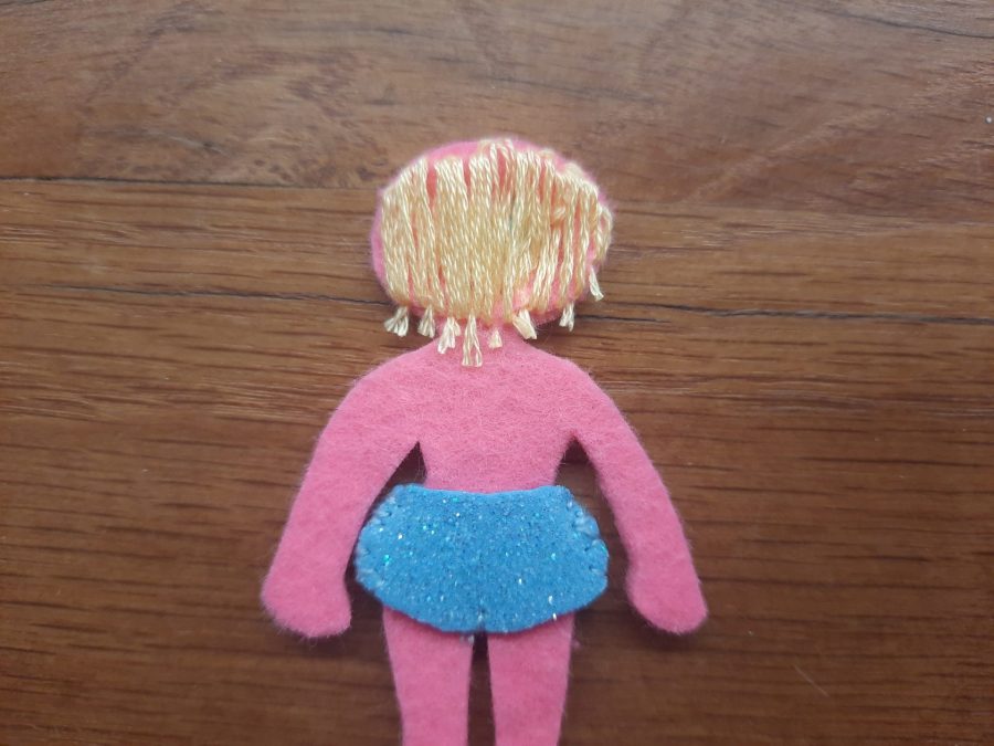 Making our felt bus book: the doll and her clothes