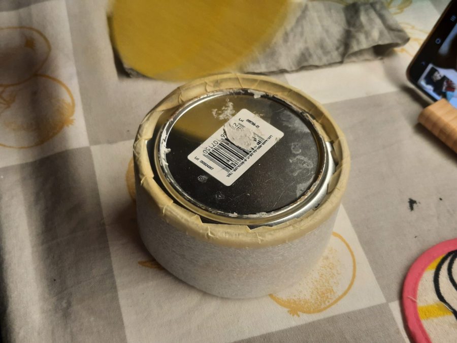 Upholstering the metal tin to protect the fabric