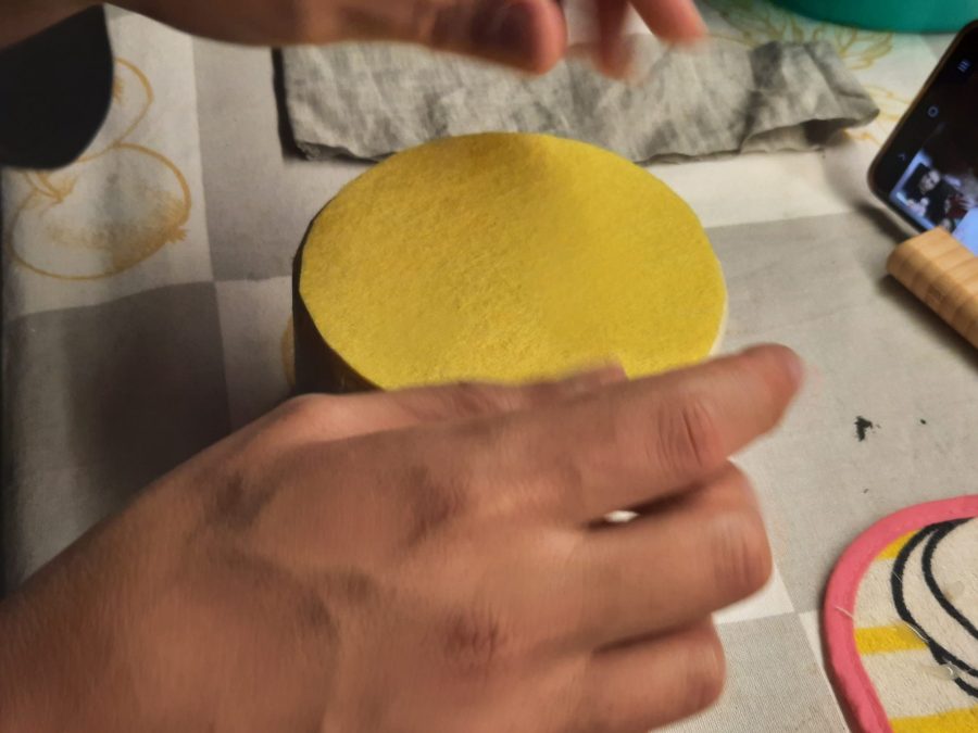 Upholstering the metal tin to protect the fabric