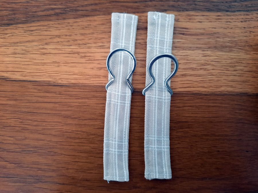 The attachments for my bodhran bag's shoulder strap, ready to be secured to the bag