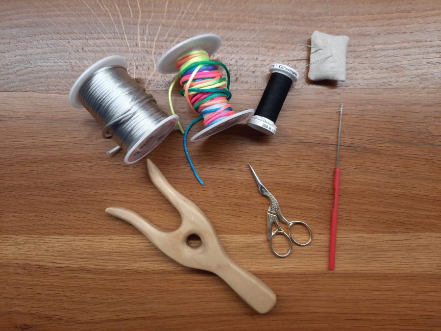 Materials needed to make I-cord animals using the lucet