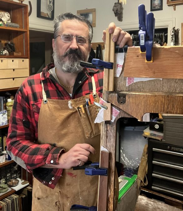 Darren, the founder of The Sewing Machine Orphanage, working on the restoration of a Singer 66