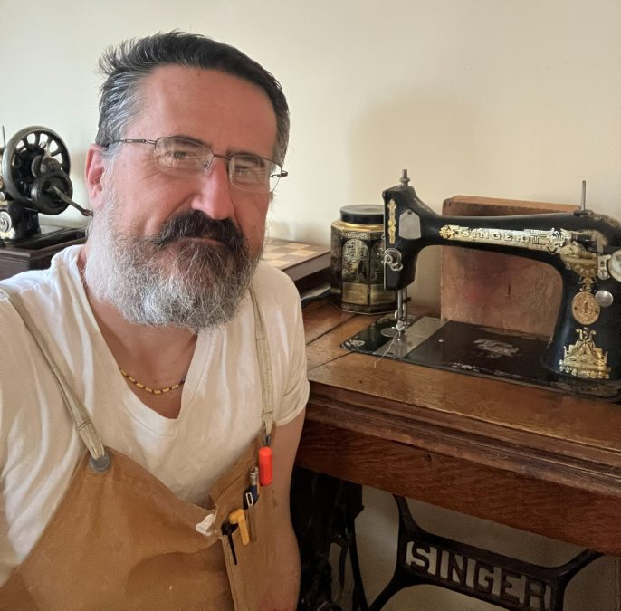 Darren, the founder of The Sewing Machine Orphanage, with her grandmother's sewing machine