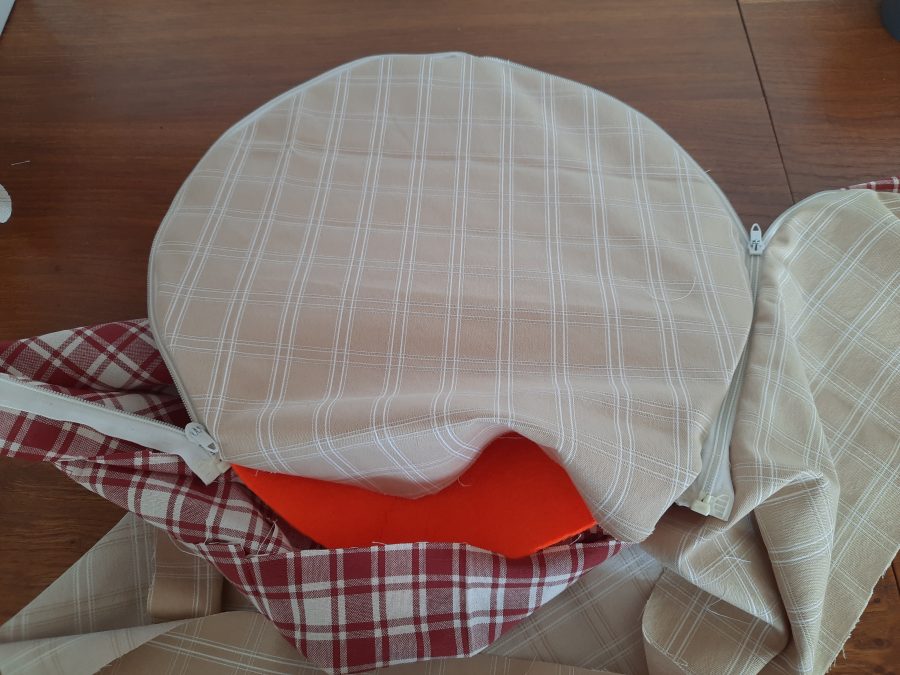 Starting to attach the wrapping strip to the circles to make my bodhran bag