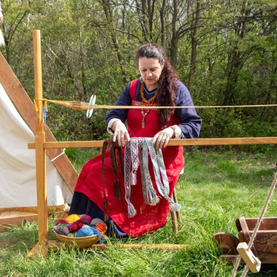 Federica of Hilda Arts & Crafts at her tablet weaving loom