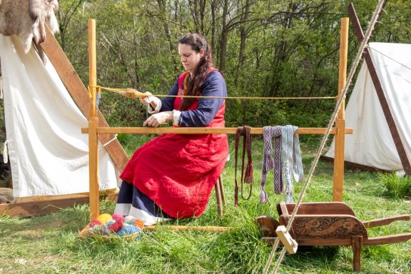 Federica of Hilda Arts & Crafts at her tablet weaving loom