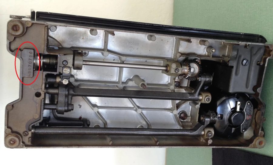 Slant-needle models like the 301A or 401A have their serial under the lip around the machine, on the left side (the needle side), stamped on a metal plate